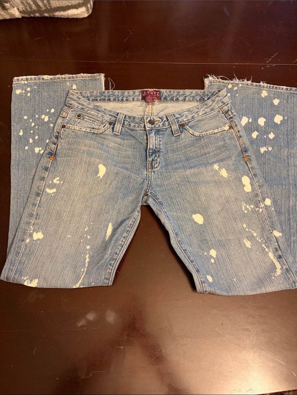 Distressed Light Blue Boot Cut Jeans - Women's